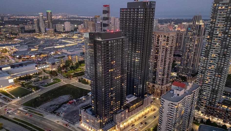 Modern residential buildings near a shopping destination offering contemporary urban living spaces