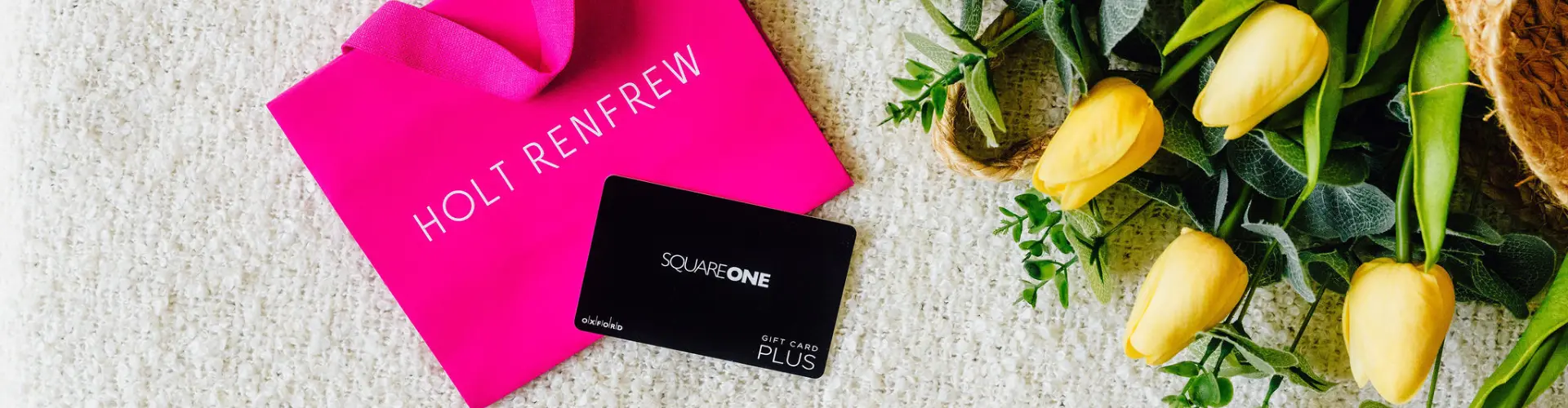 A Square One Gift Card, a Holt Renfrew Bag